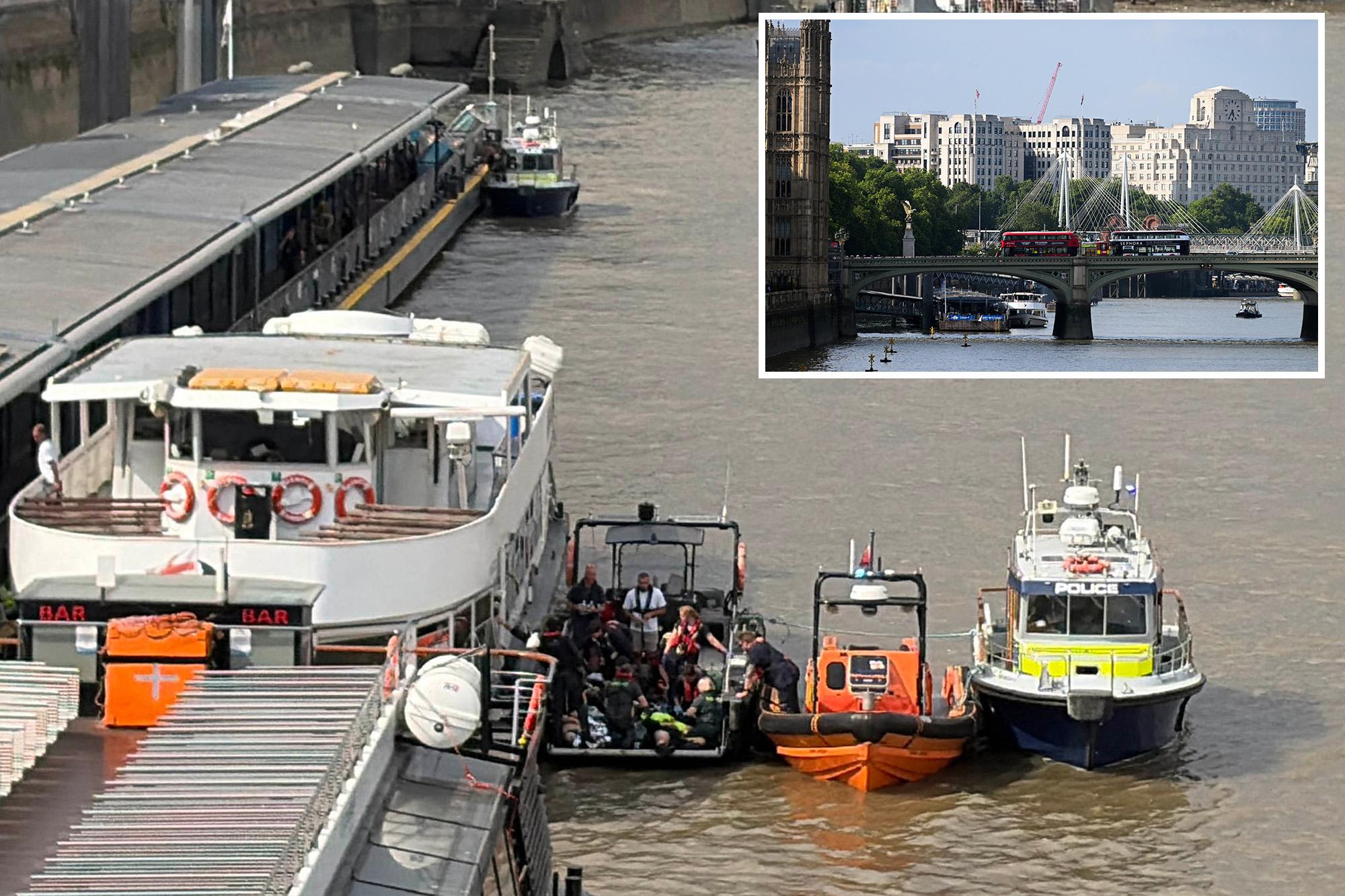 Police boat crashes into bridge in central London, sending officers into the Thames