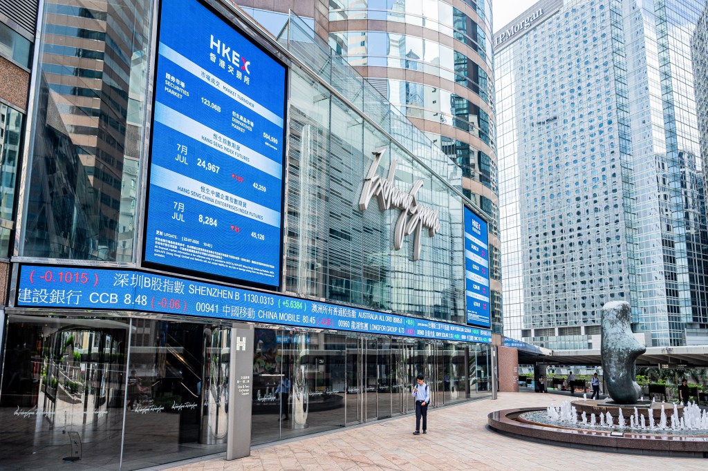 The Exchange Square Complex, home to the Hong Kong Stock Exchange, with a display showing market data.