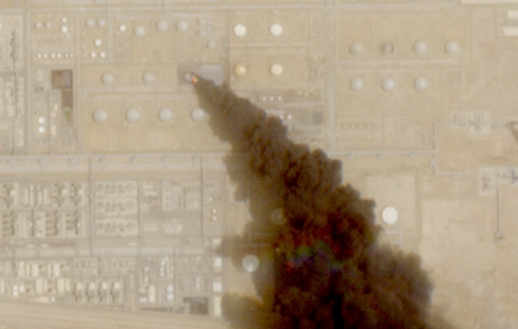 Satellite image showing a plume of smoke rising from an oil facility in Jizan, Saudi Arabia.