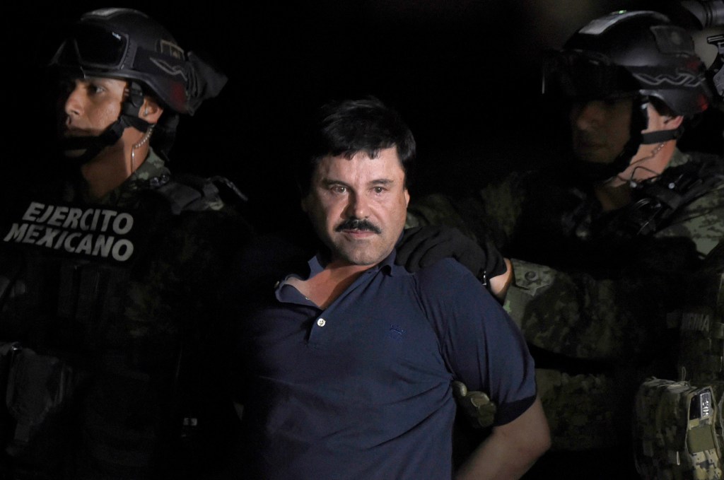 Drug kingpin Joaquin "El Chapo" Guzman escorted by Mexican Marines after his recapture.