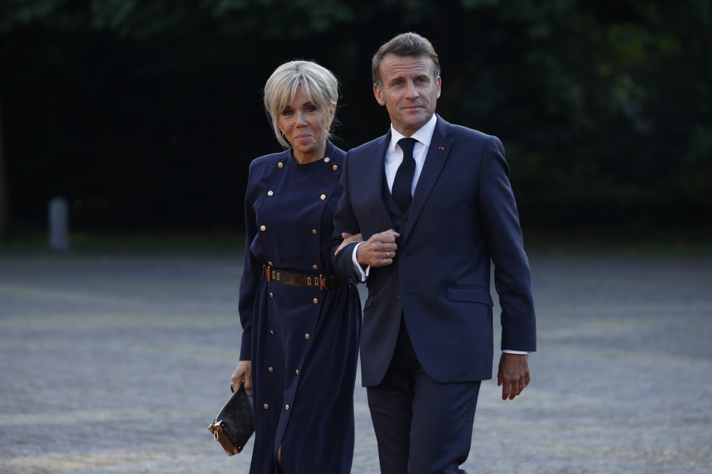 Brigitte Macron and Emmanuel Macron arriving for a dinner during the 2025 NATO Summit.