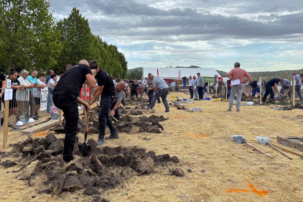Gravediggers competing in a contest in Nyergesújfalu, Hungary.