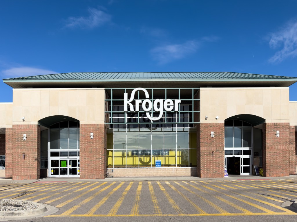 The front entrance and logo of a Kroger grocery store.