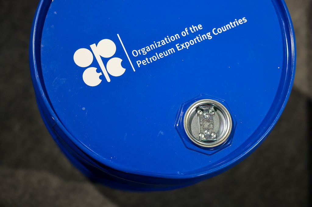 A blue oil barrel with the white OPEC logo and text "Organization of the Petroleum Exporting Countries".