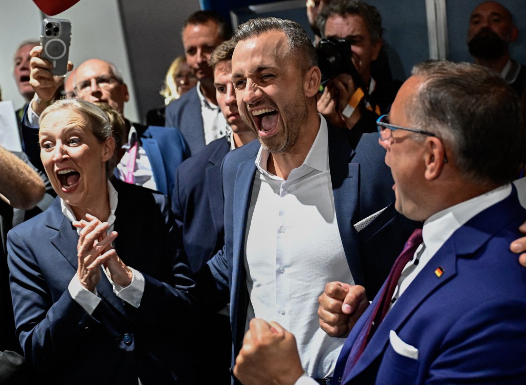 Ulrich Siegmund, Alice Weidel, and Tino Chrupalla celebrate after exit polls for Saxony-Anhalt's state elections.
