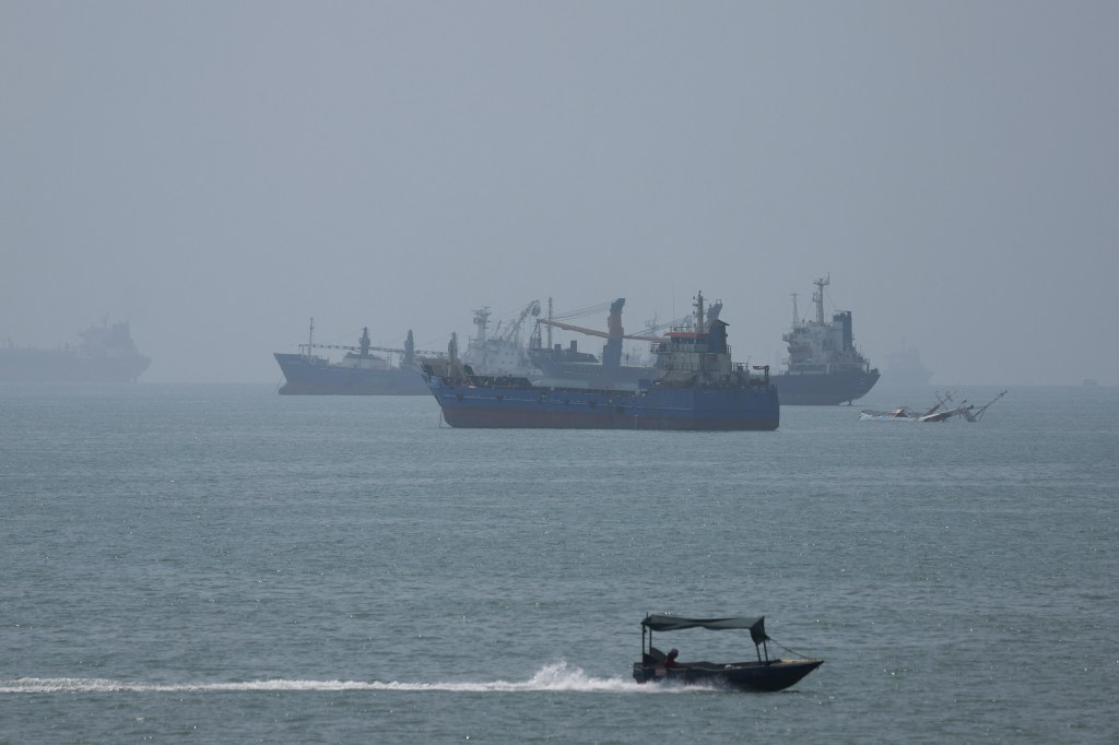 Vessels in the Strait of Hormuz are visible near the beach of Bandar Abbas, Iran.