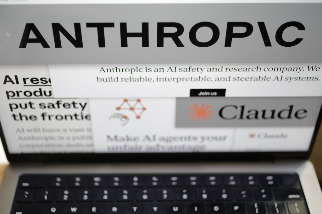 Anthropic website and company logo displayed on a laptop screen.