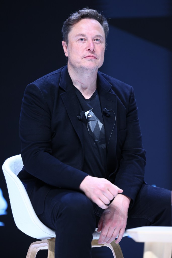 Elon Musk seated in a black jacket and t-shirt during the Cannes Lions International Festival Of Creativity.
