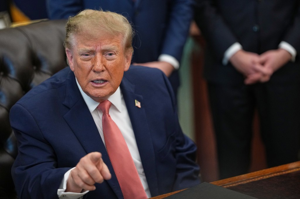 President Donald Trump speaks in the Oval Office of the White House.
