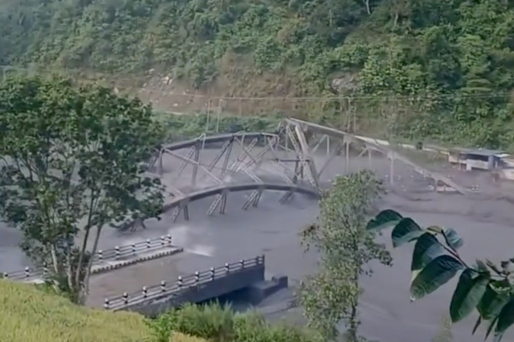 A Budhi Gandaki River bridge is wiped away by flash floods in the Gorkha district of Nepal.