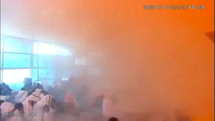 Surveillance footage showing people reacting amid smoke at the moment of an attack at King Khalid International Airport in Riyadh, Saudi Arabia.
